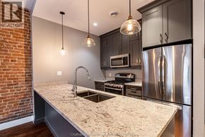 Chatham apartment for rent - A kitchen with a granite countertop and stainless steel appliances.