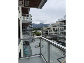 North Vancouver apartment for rent - A balcony with a glass railing and a mountain in the background.