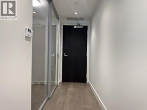 North Vancouver apartment for rent - A modern dining room with a long table and blue chairs.