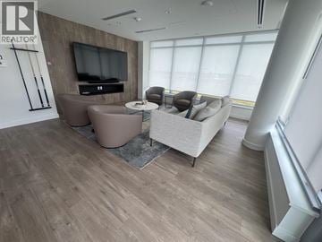 North Vancouver apartment for rent - A living room with a television and a couch.