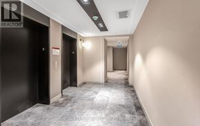 Milton (Cb Cobban) condo for rent - A long hallway with doors on the left and right.