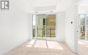 Milton (Cb Cobban) condo for rent - A room with a sliding glass door and a white wall.