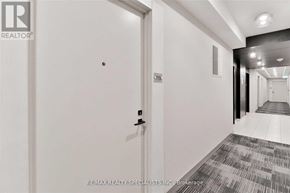 Mississauga (Central Erin Mills) condo for rent - A hallway with a door on the left and a hallway on the right.