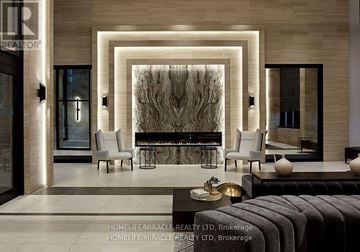 Toronto (Etobicoke West Mall) condo for rent - A modern living room with a large abstract painting on the wall.