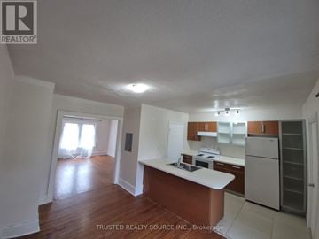 Windsor multi-family for rent - A kitchen with a white counter top and wooden floors.