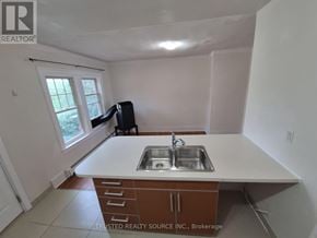 Windsor multi-family for rent - A kitchen with a sink and a window.
