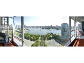 Vancouver apartment for rent - A view from a high-rise building looking out over a cityscape and a body of water.