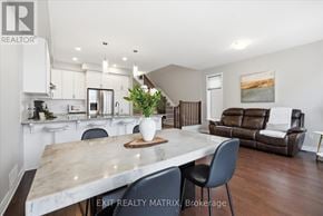 Russell townhouse for rent - A modern kitchen with a marble table and chairs.