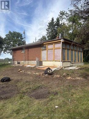 Clarington apartment for rent - A house under construction with a brown roof and yellow framing.