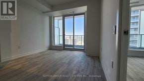 Toronto (Newtonbrook East) condo for rent - A room with a view of the city through large windows.