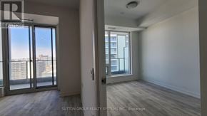 Toronto (Newtonbrook East) condo for rent - A room with a view of a cityscape through large windows.