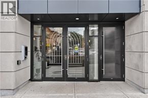 Hamilton apartment for rent - The entrance to a building with a glass door and a sign that says REALTOR.