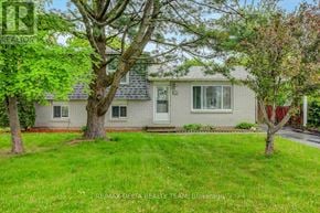 Ottawa apartment for rent - A house with a tree in front of it.