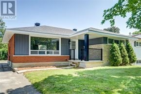 Ottawa apartment for rent - A house with a brick facade and a black gate.
