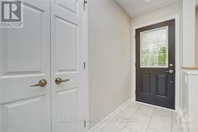 Ottawa apartment for rent - A white door with a gold handle is next to a black door with a gold handle.