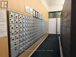 Toronto (Church-Yonge Corridor) condo for rent - A hallway with a row of mailboxes on the wall.