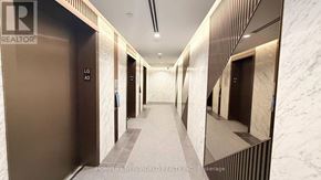 Toronto (Bayview Village) condo for rent - A hallway with marble walls and doors labeled LG A2, LG A3, LG A4, and LG A5.