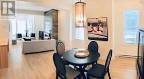 St.John's multi-family for rent - A dining room with a table set for four.