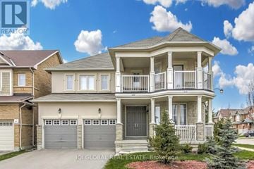 Richmond Hill (Jefferson) apartment for rent - A two-story house with a balcony and garage doors.