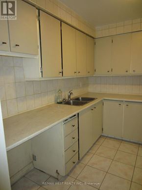 Toronto (Humber Summit) apartment for rent - A kitchen with white cabinets and a sink.