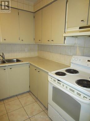 Toronto (Humber Summit) apartment for rent - A kitchen with a stove, sink, and cabinets.