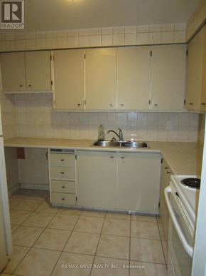 Toronto (Humber Summit) apartment for rent - A kitchen with white cabinets and a sink.