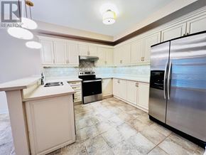 Vaughan (Vellore Village) apartment for rent - A kitchen with a stove, oven, and refrigerator.