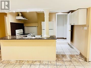 Vaughan (Vellore Village) apartment for rent - A kitchen with a counter top and a fridge.