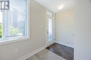London North (North F) townhouse for rent - A room with a door and a window with blinds.