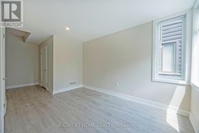 London North (North F) townhouse for rent - A room with a window and a door in it.