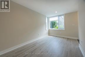 London North (North F) townhouse for rent - A spacious room with wooden flooring and a window letting in natural light.