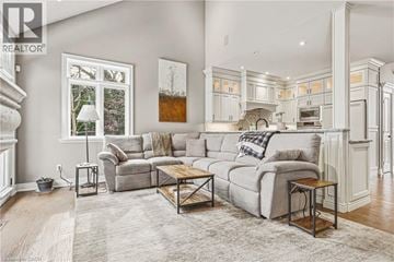 Burlington apartment for rent - A well-lit, spacious living room with a grey sofa and a coffee table.