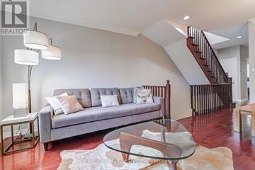 Toronto (Casa Loma) townhouse for rent - A living room with a grey couch and a glass coffee table.