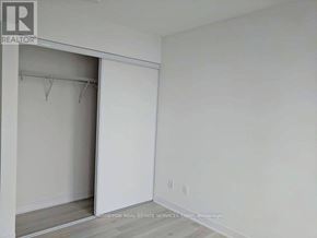 Toronto (Waterfront Communities) condo for rent - A room with a white wall and a white closet door.