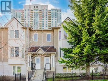 Toronto (Bendale) townhouse for rent - A house with a tree in front of it.