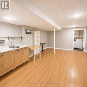 Richmond Hill (North Richvale) townhouse for rent - A kitchen area with wooden floors and white walls.