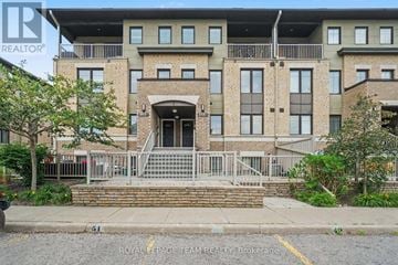 Ottawa townhouse for rent - A building with a sign that says "REALTOR" in front of it.