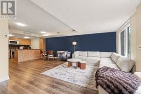 Ottawa townhouse for rent - A spacious living room with a kitchen area in the background.