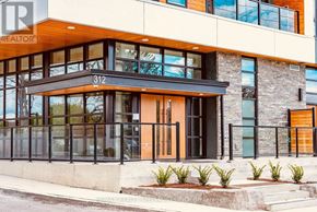 Waterloo condo for rent - A modern building with a glass entrance and a number 312 on the window.