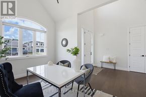 Thames Centre apartment for rent - A dining room with a white table and chairs.