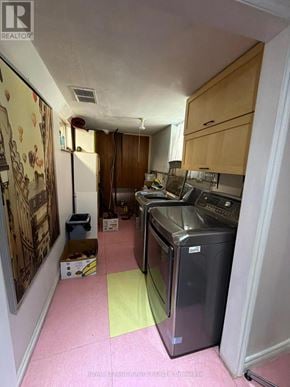 Toronto (Dorset Park) apartment for rent - A kitchen with a washing machine and a fridge.