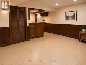 Vaughan (East Woodbridge) apartment for rent - A room with wood paneling and a wooden door.