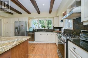 Caledon (Cheltenham) apartment for rent - A kitchen with wooden floors and a marble counter top.