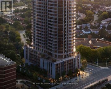 Mississauga (Mississauga Valleys) condo for rent - A tall residential building is under construction in a suburban area.