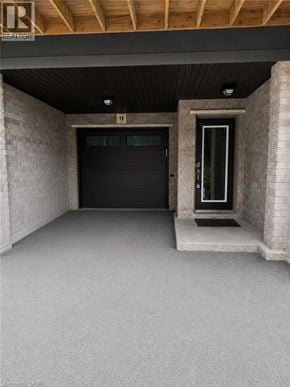 Stoney Creek townhouse for rent - A garage with a black door and a white door.