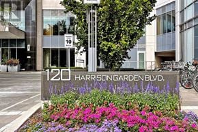 Toronto (Willowdale East) condo for rent - A street sign for 120 Harrison Garden Blvd. is in front of a building.