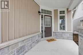 Georgina (Sutton & Jackson's Point) apartment for rent - A house with a brown door and a sign on the ground.