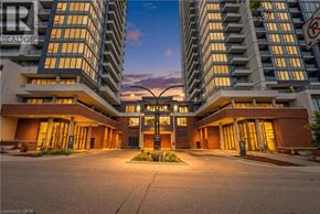 Kitchener condo for rent - A building with a sign that says REALTOR in front of it.