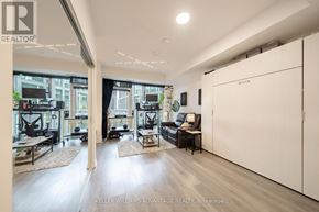 Toronto (Waterfront Communities) condo for rent - A spacious living room with a view of the city.