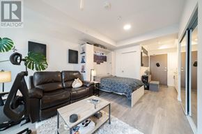 Toronto (Waterfront Communities) condo for rent - A living room with a black leather couch and a coffee table.